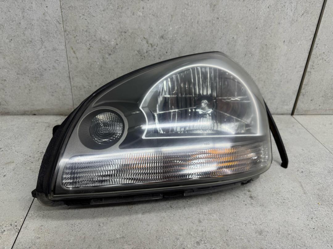 фара левая Hyundai Tucson 1 поколение 2007, 921012E010 - фото №1