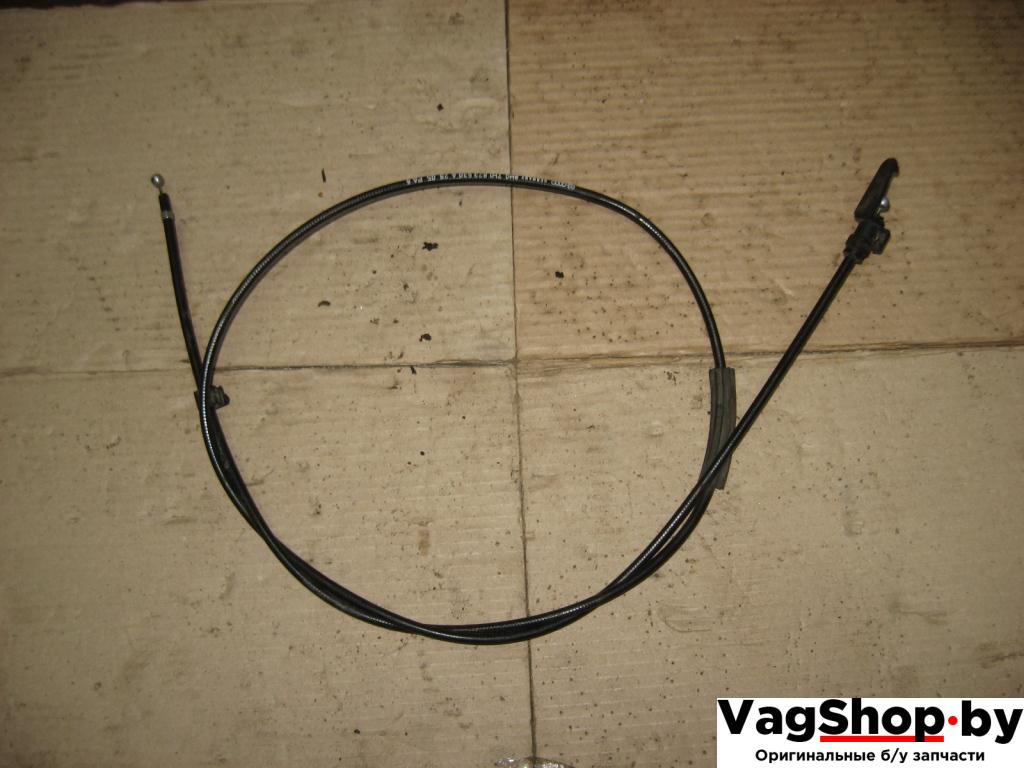 трос капота Volkswagen Caravelle 5 2006, 2.5 л., TDi, AXD, дизель, МКПП, красный, минивэн, передний привод, 7H1823530A - фото №1