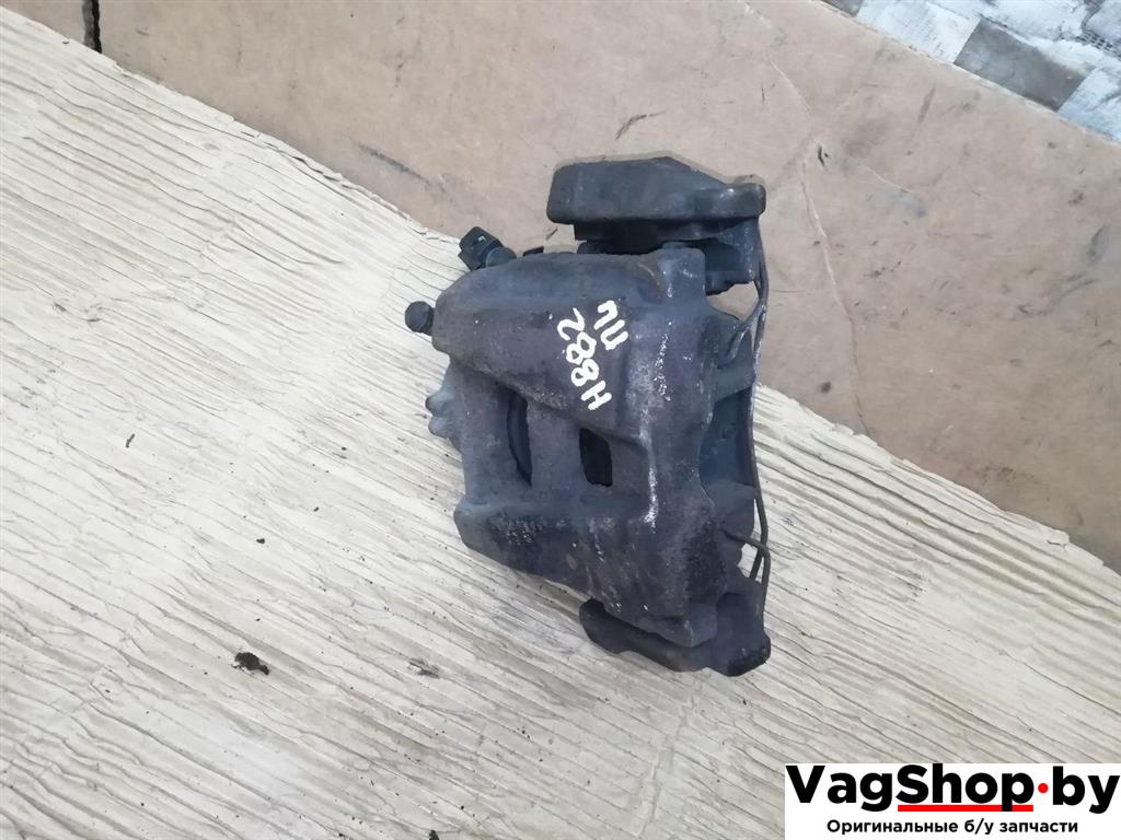 суппорт передний левый Volkswagen Tiguan 1 поколение 2010, 2.0 л., TDi, CFG, дизель, МКПП, серебро, внедорожник 5 дв., полный привод - фото №1